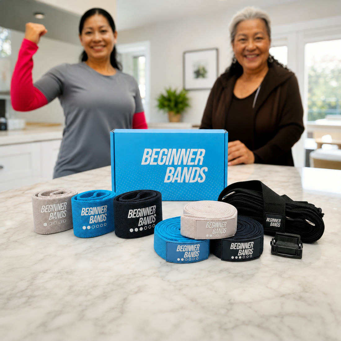 Two women smiling behind the Beginner Bands box and the full set on a kitchen counter
